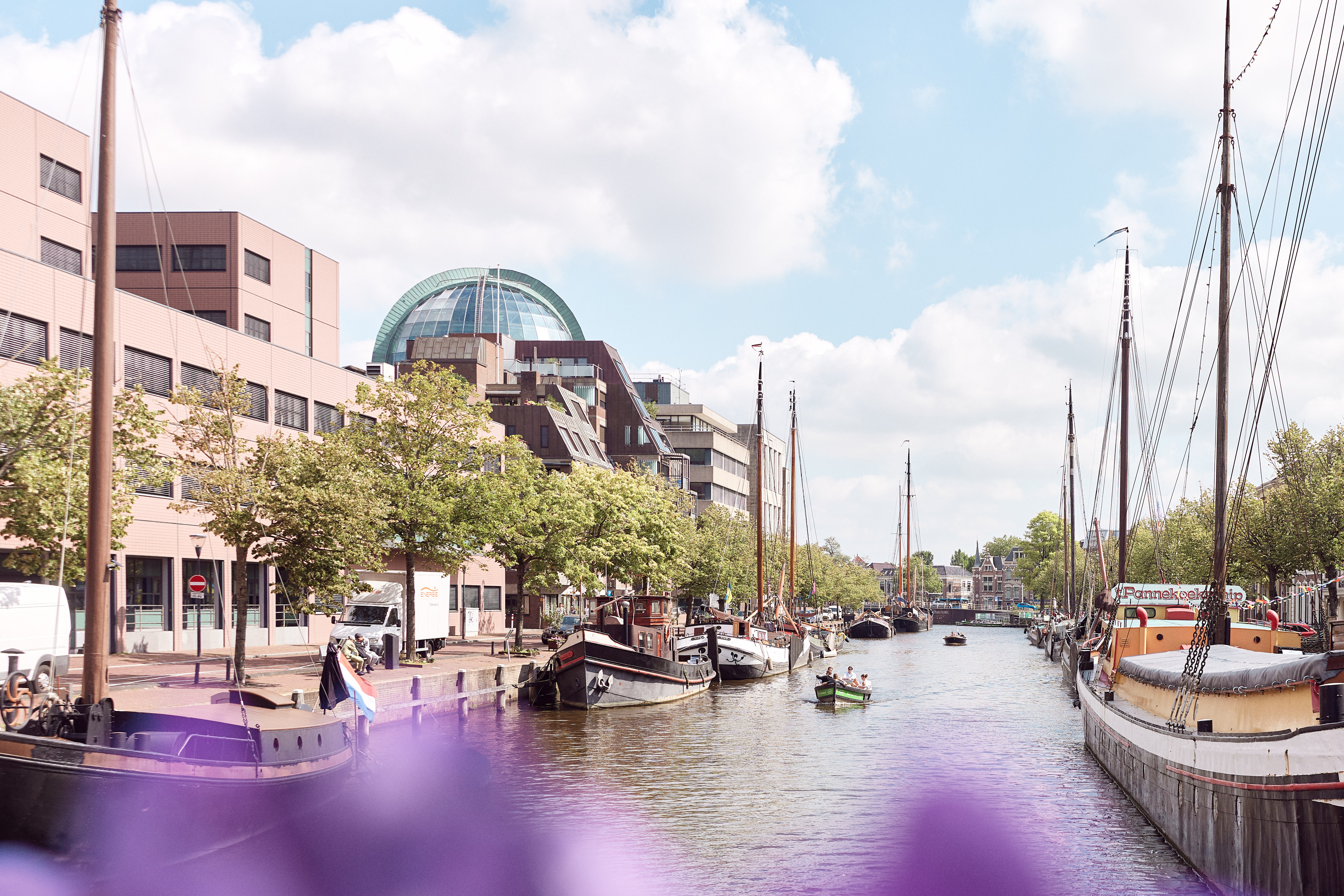Praam sailing through the canals of Leeuwarden