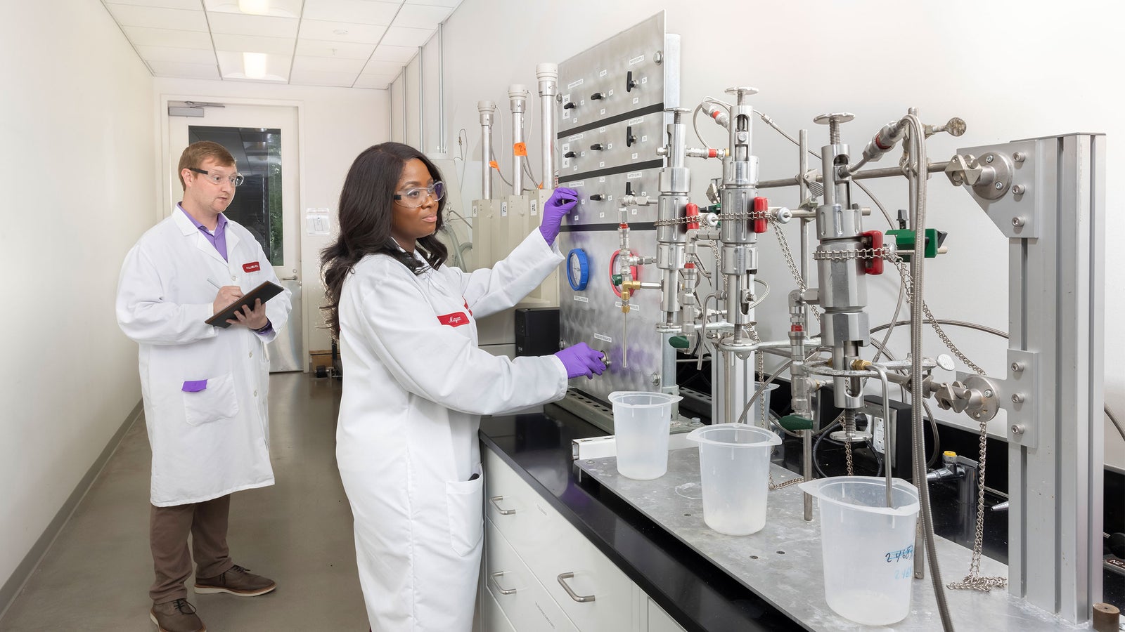 Halliburton lab employee working with cementing solutions