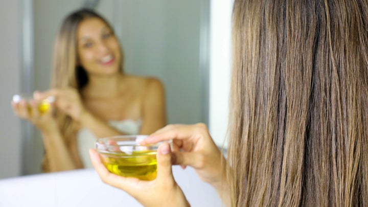 woman applying hair mask