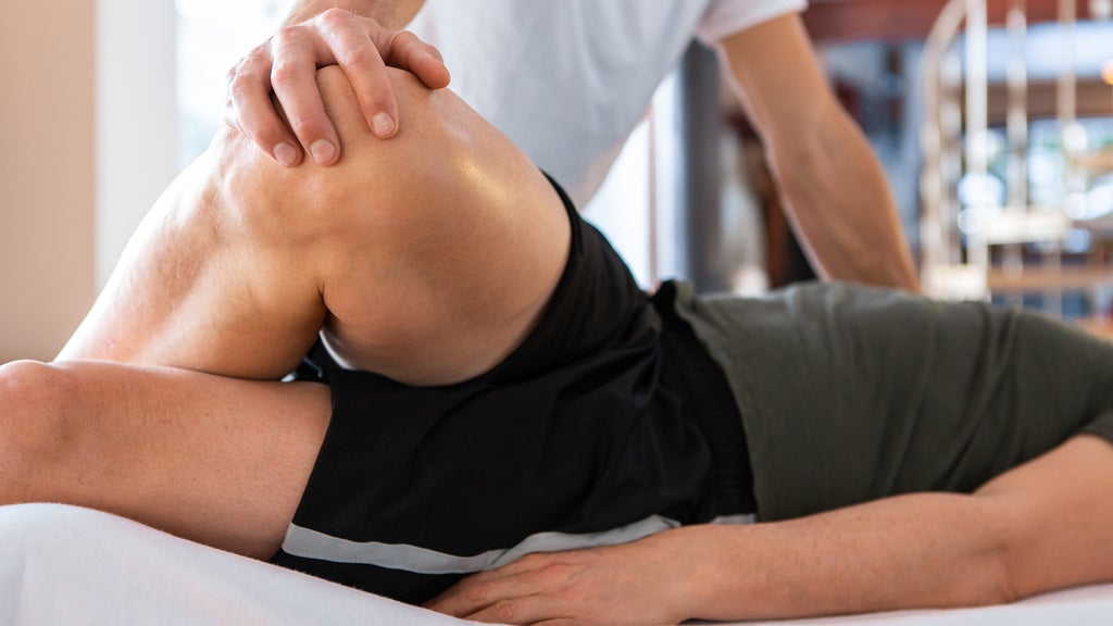 massage therapist working with an athlete