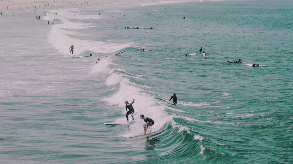 surfers in the water viewed from above