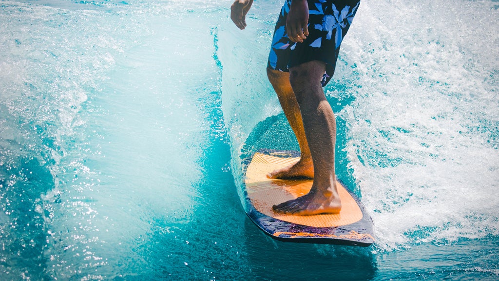 close-up shot of the surfer on his board