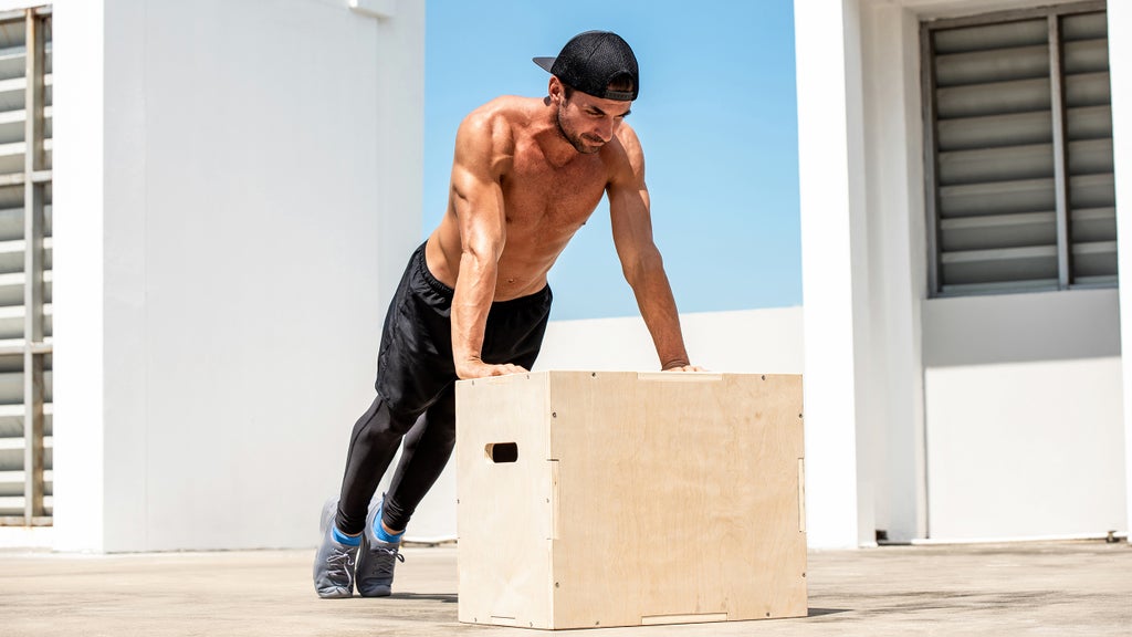 man working out on the roof of a building