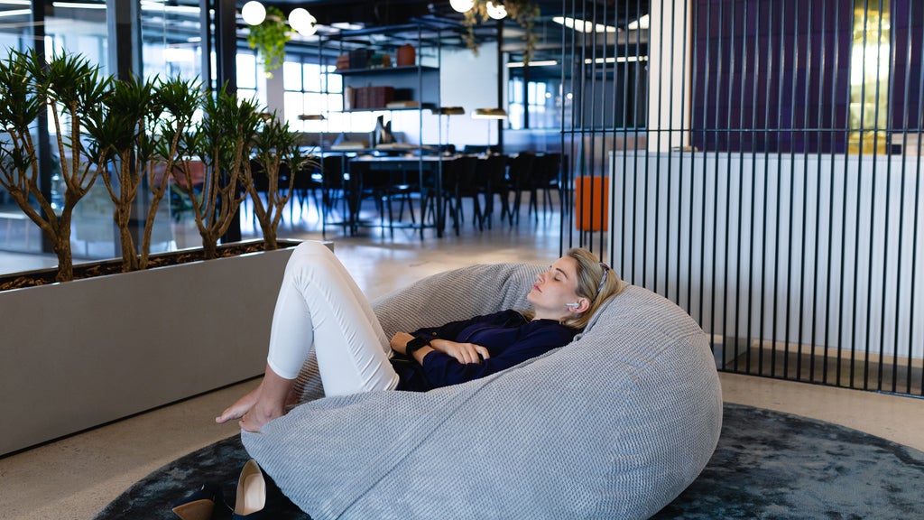 woman taking a power nap at the office