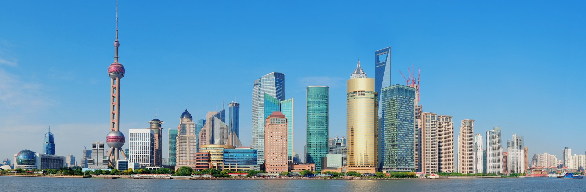 Skyline of Shanghai’s financial district, featuring iconic towers including the Oriental Pearl Tower and Shanghai Tower. Shanghai is the location of pharma expo CPHI and PMEC China 2025 where SHL Medical will showcase our autoinjector devices.