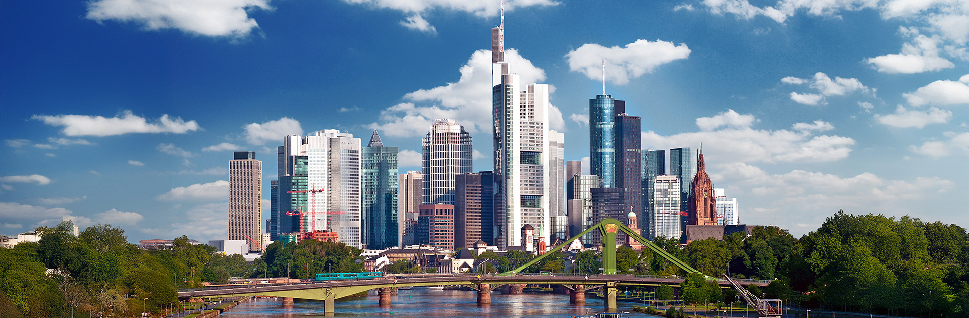 Skyline view of Frankfurt, Germany, with high-rise buildings and a bridge in the foreground. Frankfurt is where the pharma expo CPHI Frankfurt 2025 is held, and SHL Medical will showcase its autoinjector devices at Booth #8.0F60.