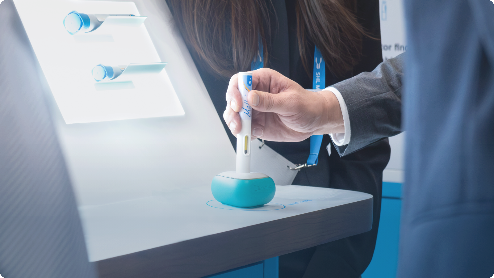 SHL Medical’s Molly autoinjector being pressed against an injection pad during simulated self-injection.