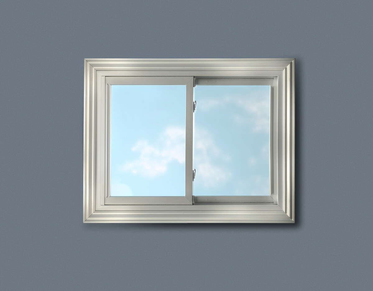 white sliding window installed in blue-gray wall, showcasing clean lines and modern trim