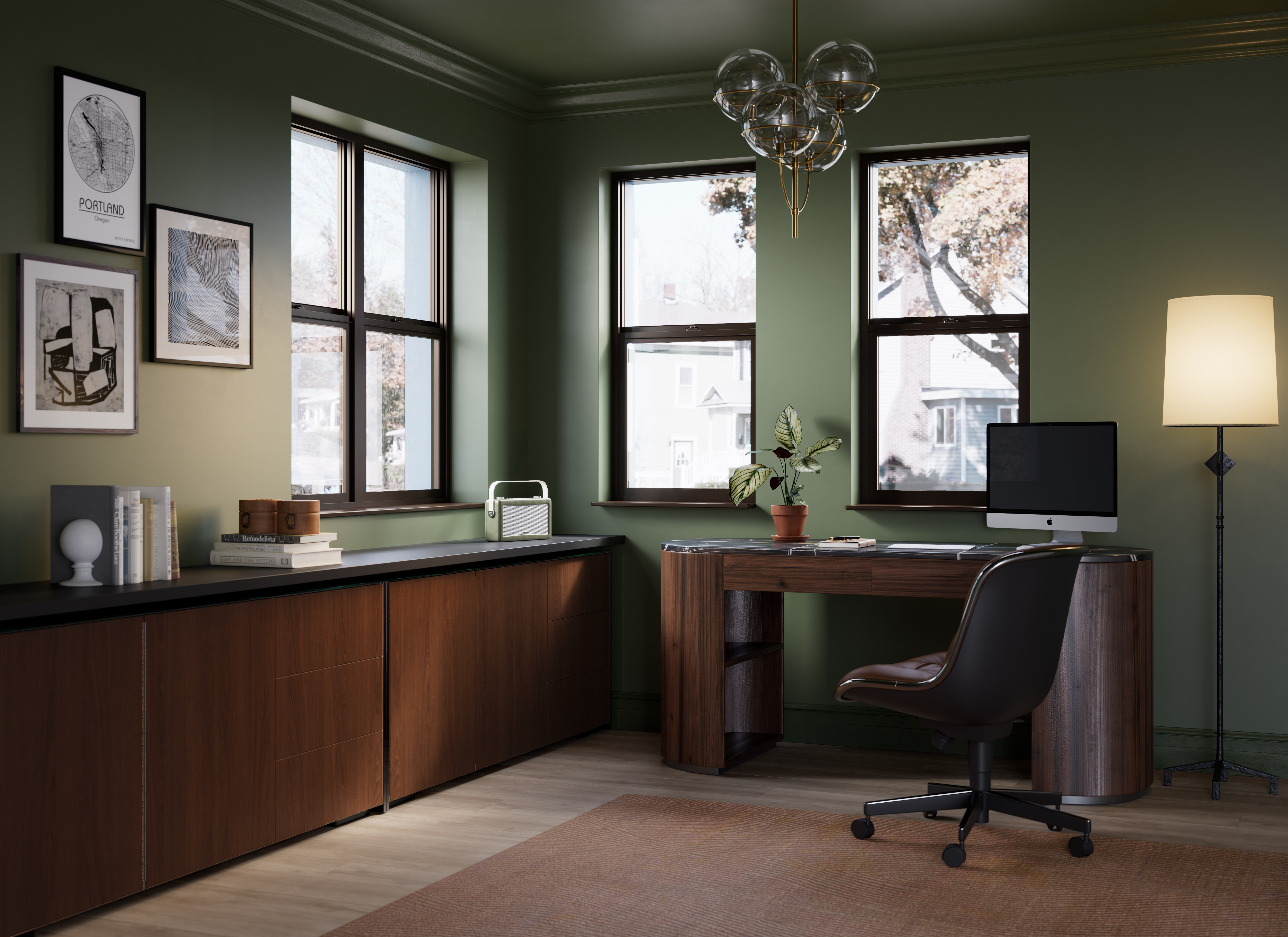 An cozy, modern office with bronze double-hung windows