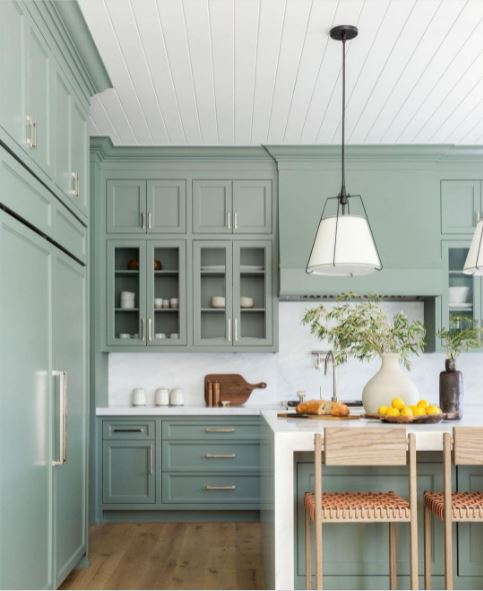 Green cabinets in a large kitchen