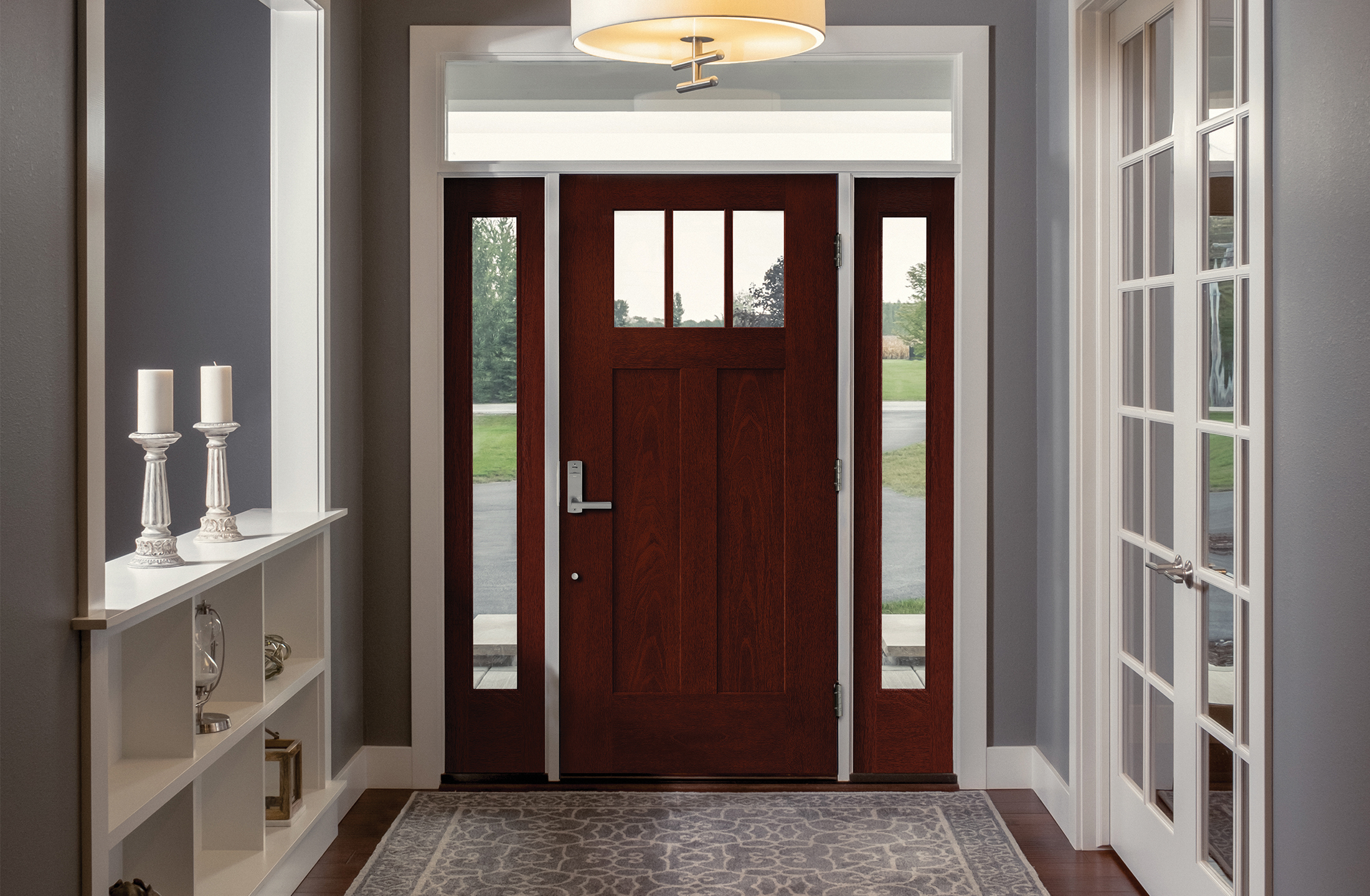A Mulberry colored Fiber-Classic® Fiberglass Entry Door with 2 full lite sidelites as seen from inside the living room