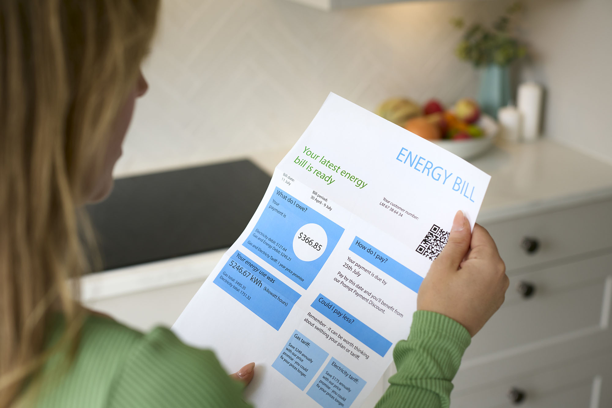 Woman looking at her home energy bill.