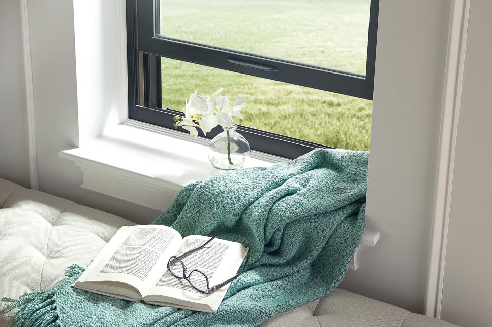 A reading nook that has an open window