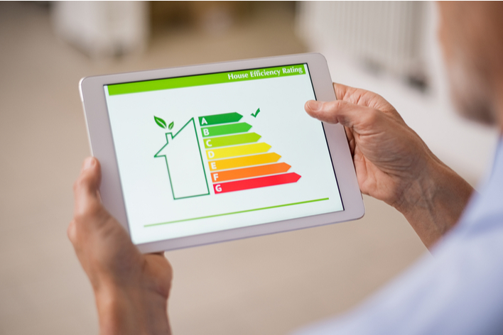 A man looking at his home energy-efficiency score on his iPad