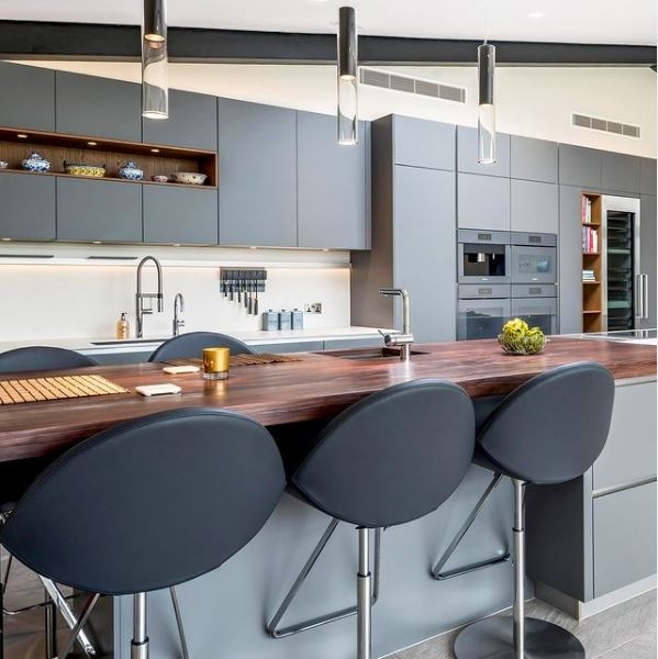 A modern kitchen with sleek cabinets and futuristic decor