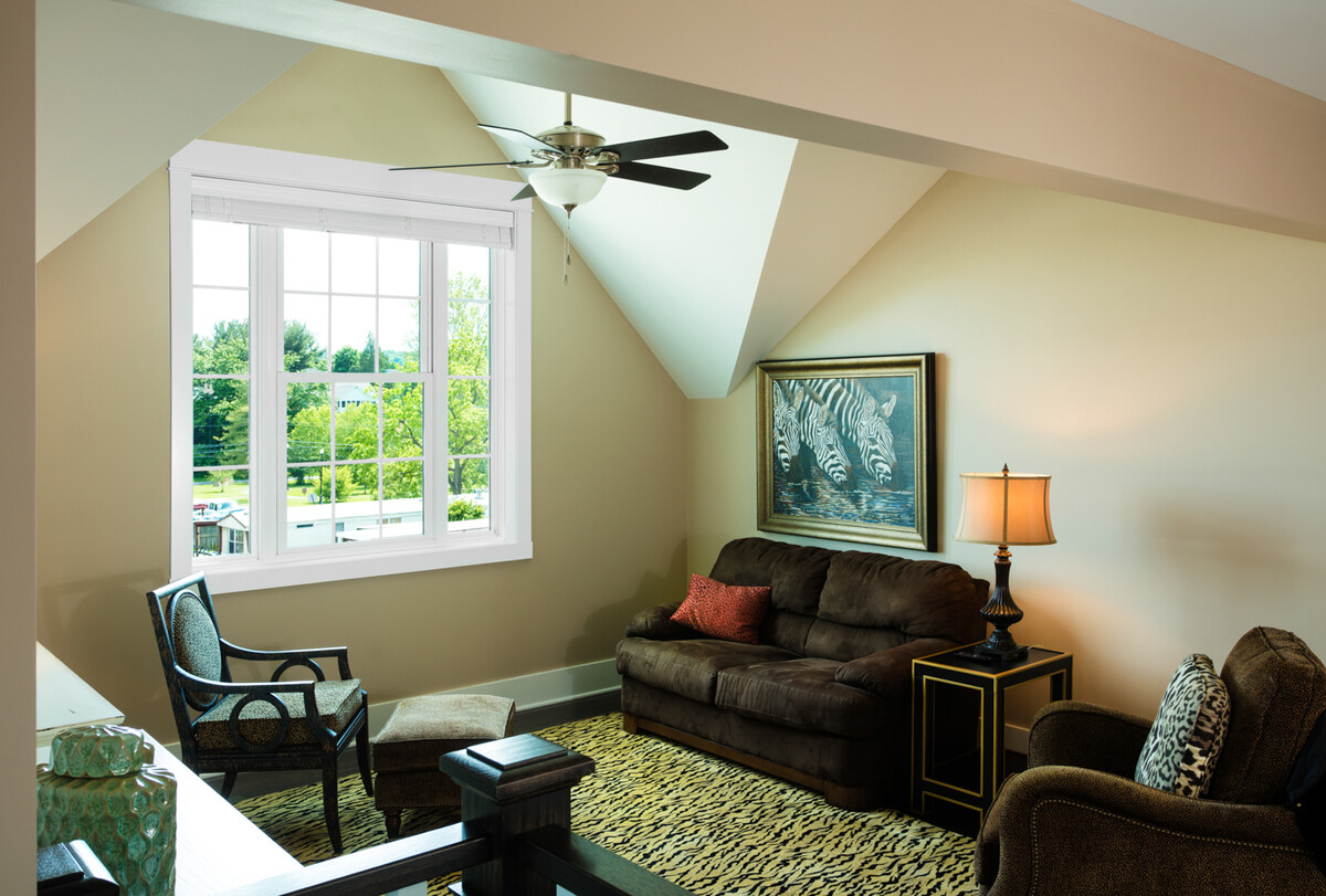 Interior view of impact double hung and picture windows beneath angled ceiling