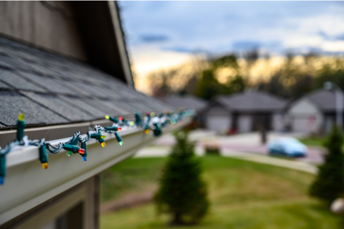 Christmas lights on a gutter