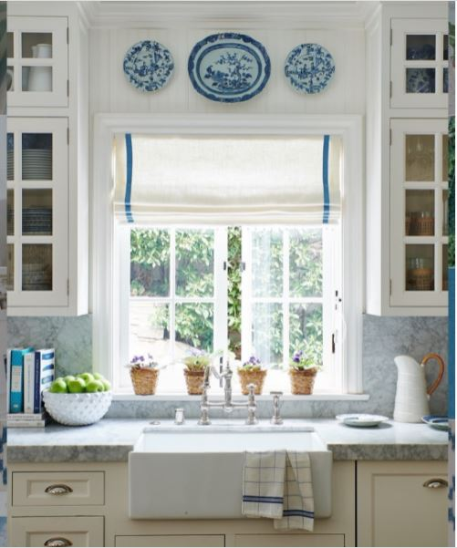 A casement window above the sink in a quaint and charming kitchen