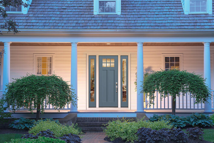 A home with low-maintenance landscaping around the front porch