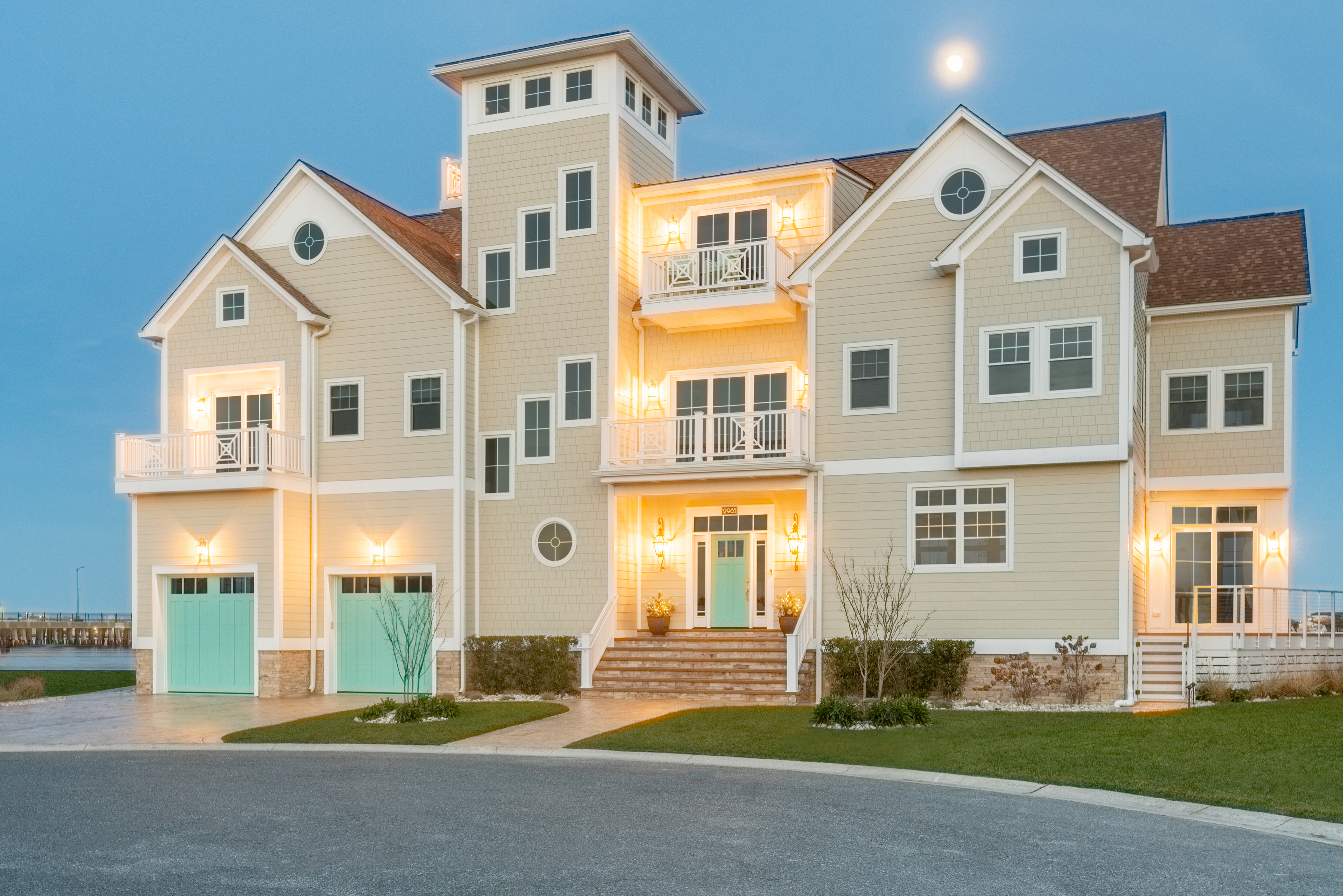 Large 3-story coastal home with hardie plank and shingle in Navajo Beige