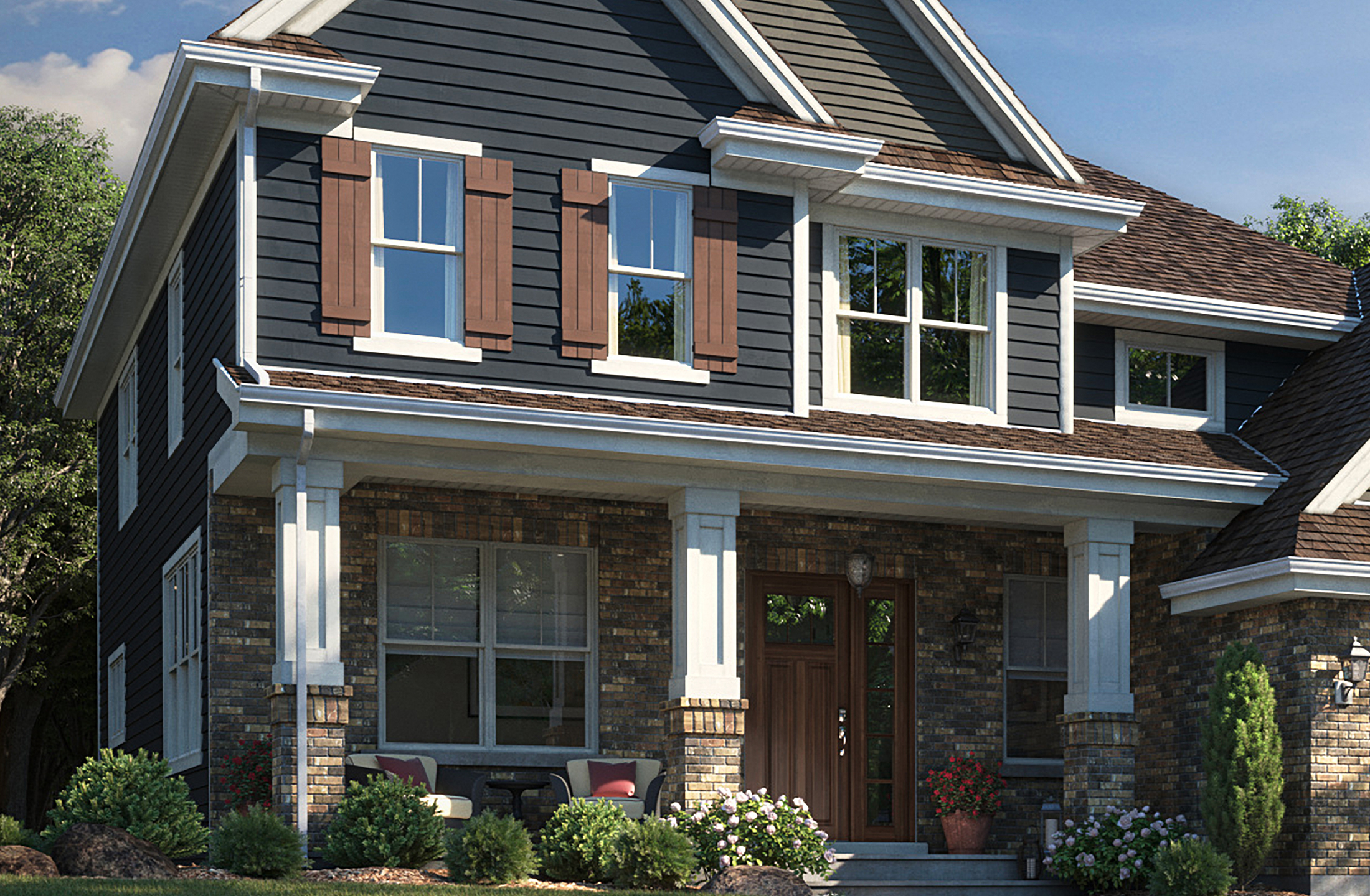 A 2-story house with white gutters on it.