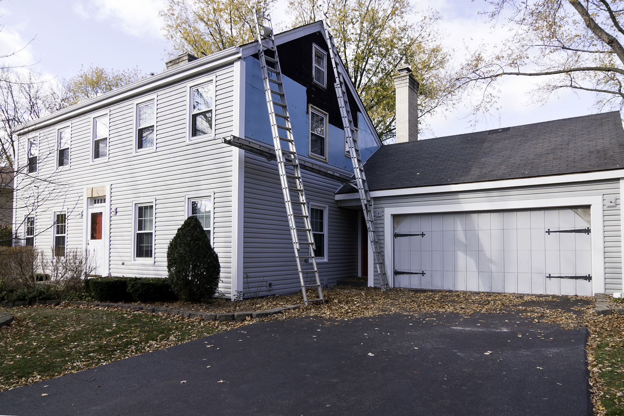 New vinyl siding installation on a family home