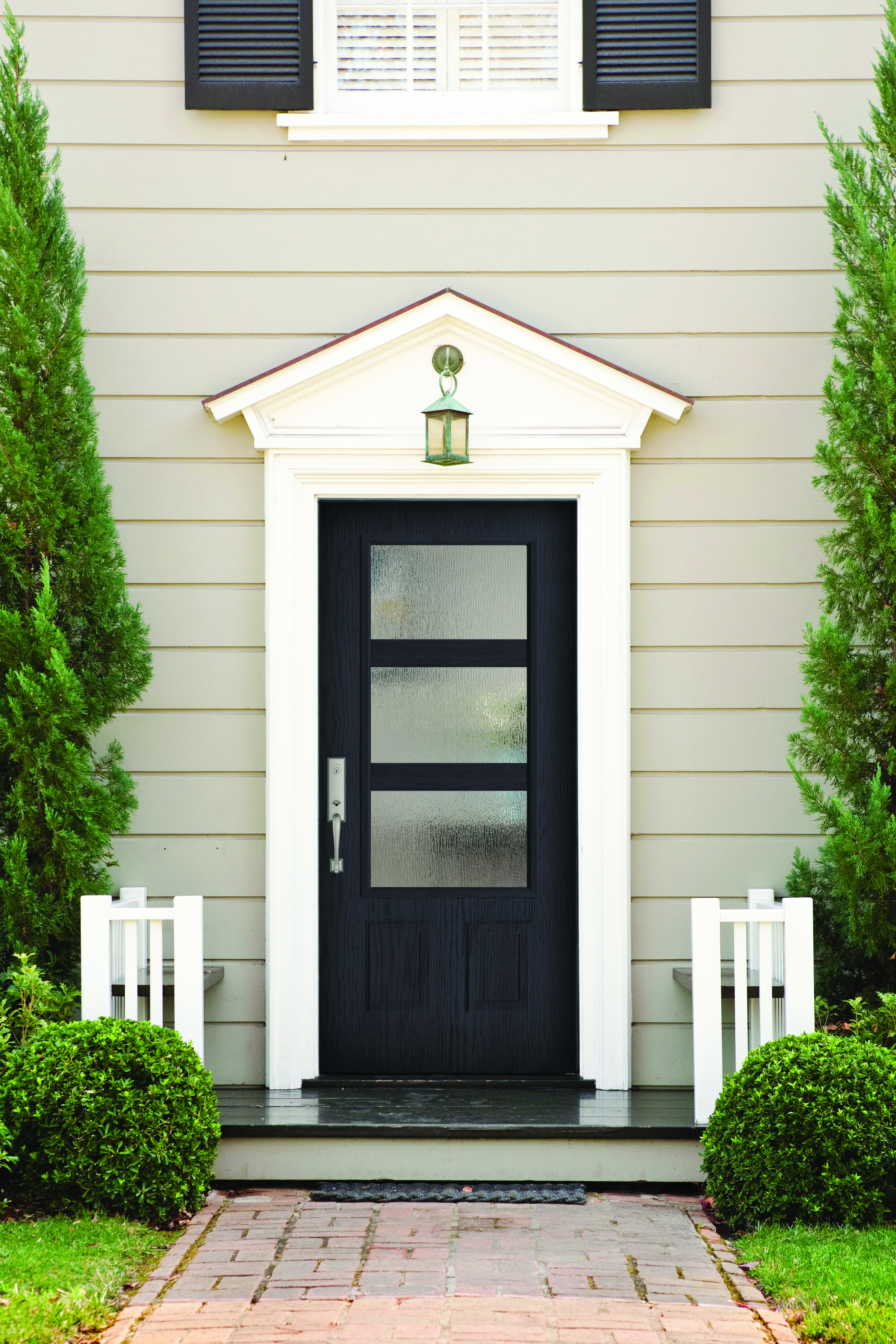 Textured Steel Entry Door, in a 3/4 Lite, 2 Panels door style and Modern Wide Simulated Divided Lites with Rain glass, prefinished in Obsidian, and with a Baldwin Del Mar Handleset in Satin Nickel.