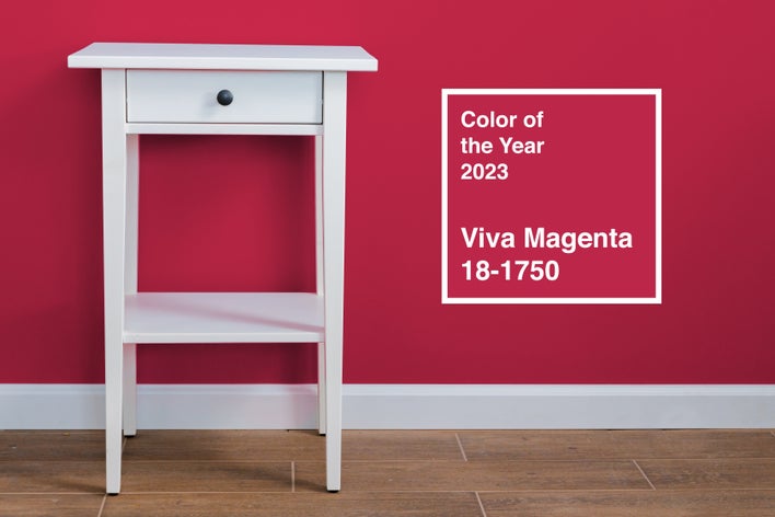 Pantone Color of the Year 2023, Viva Magenta, on an accent wall to contrast with a white table