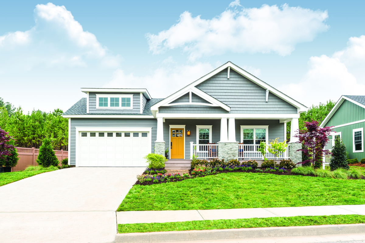 White short panel garage door with clear windows on a contemporary home