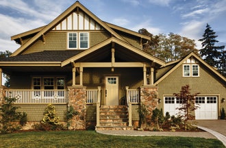 Craftsman-style home with a smooth fiberglass entry door, with a Craftsman Lite, 2-Panel Flat Shaker door style and Simulated Divided Lite glass, prefinished in French Manor.