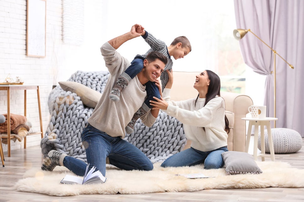 Family In Living Room Window World