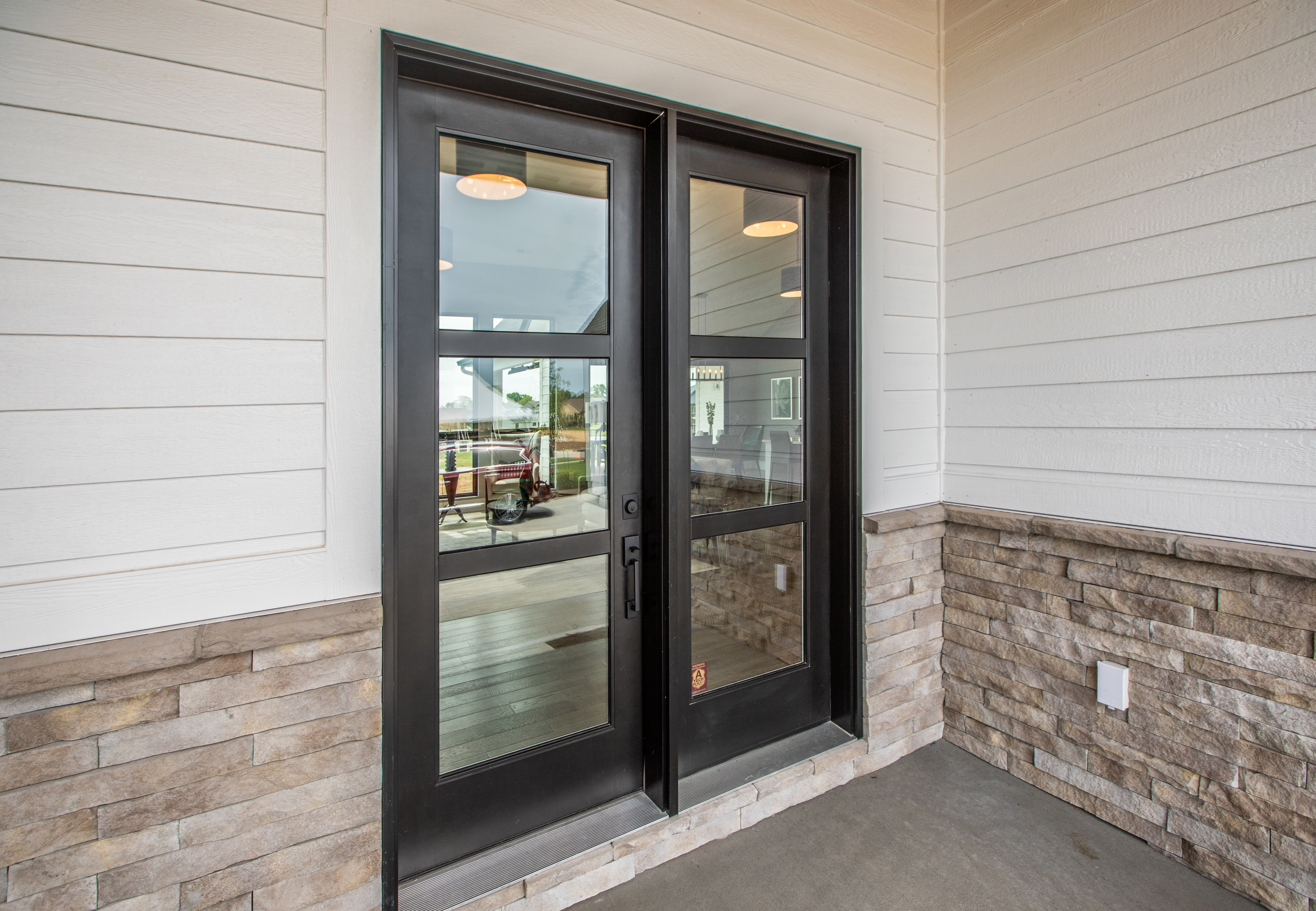 A black hinged patio door