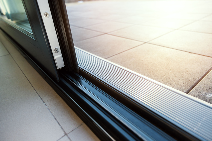 A sliding patio door with weatherstripping.