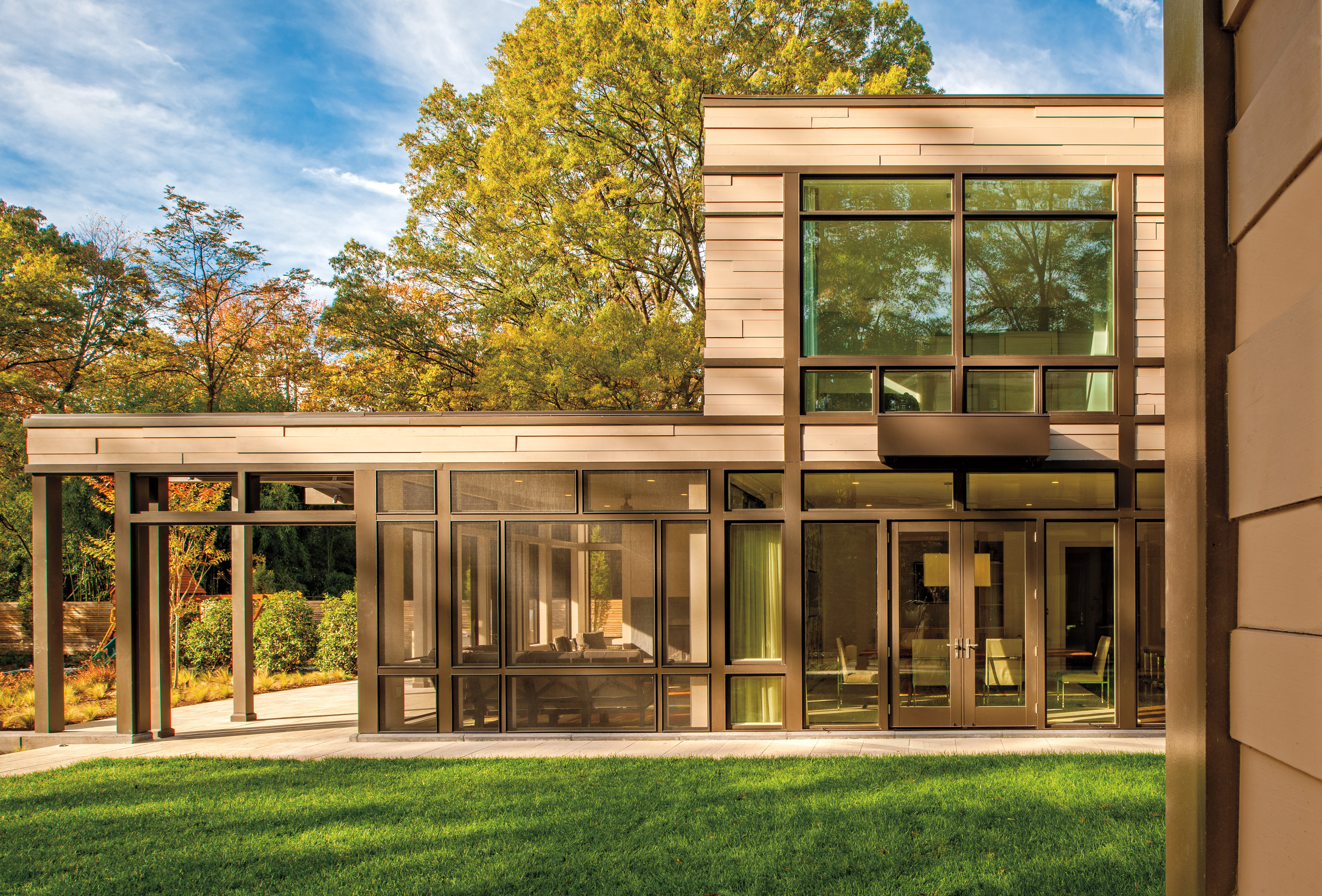 A brown hinged patio door with 2 functioning panels