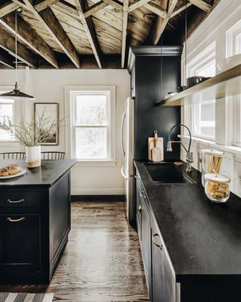 A rustic, farmhouse-style kitchen in black and white A rustic, farmhouse-style kitchen in black and white