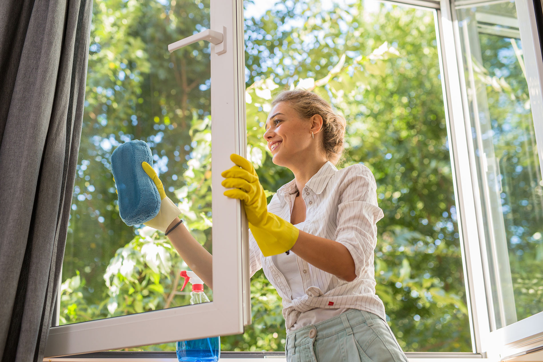 Woman Cleaning Window