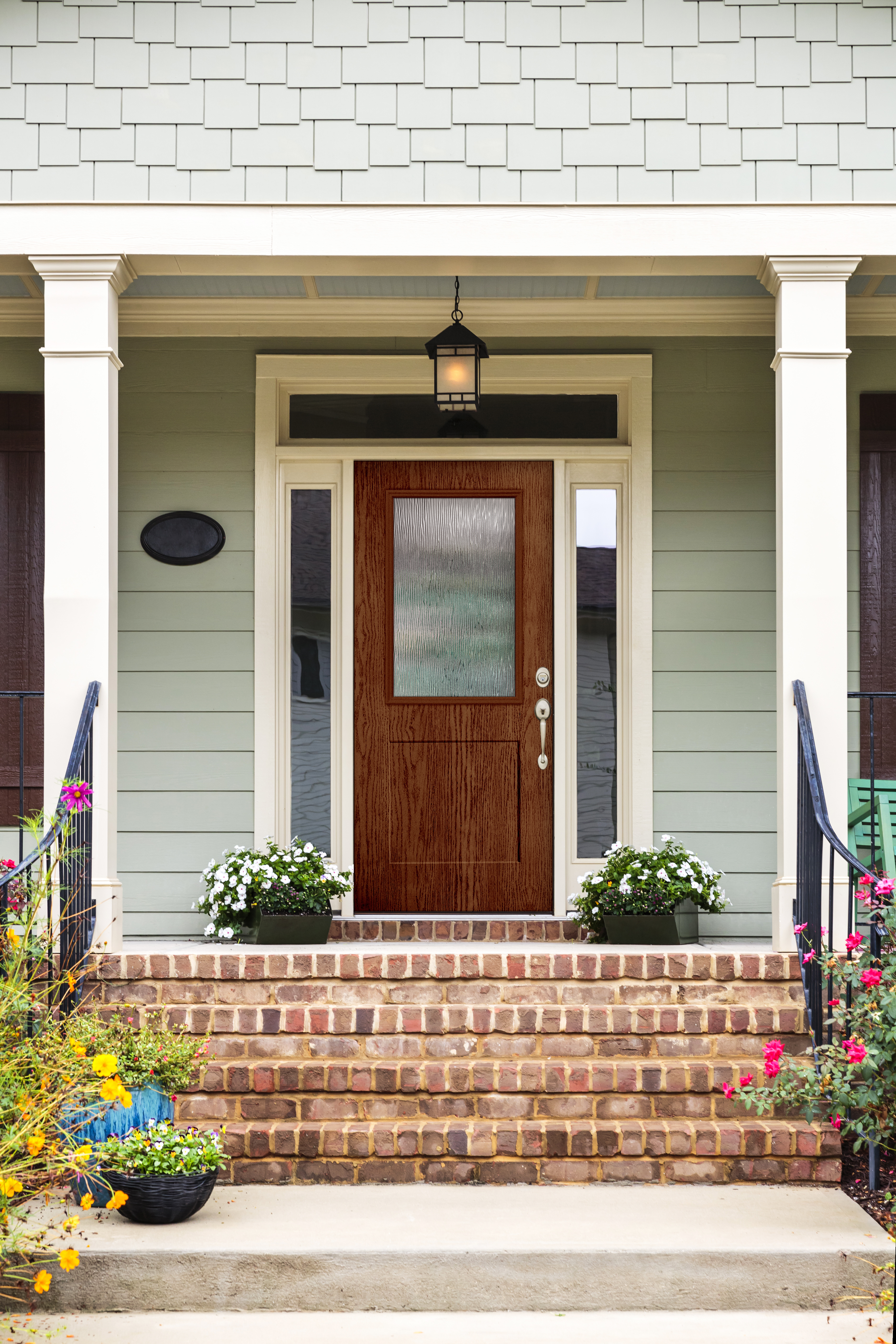 Textured Steel Entry Door, with a 1/2 Lite, 1-Panel Flat Shaker door style and Streamed glass, with Plymouth Handleset hardware in Satin Nickel.