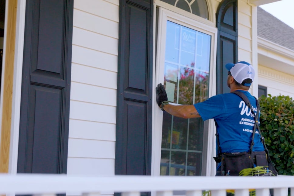 Window world installer putting in new replacement windows