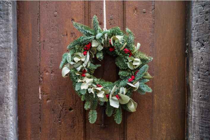 A Christmas wreath hung on a tree
