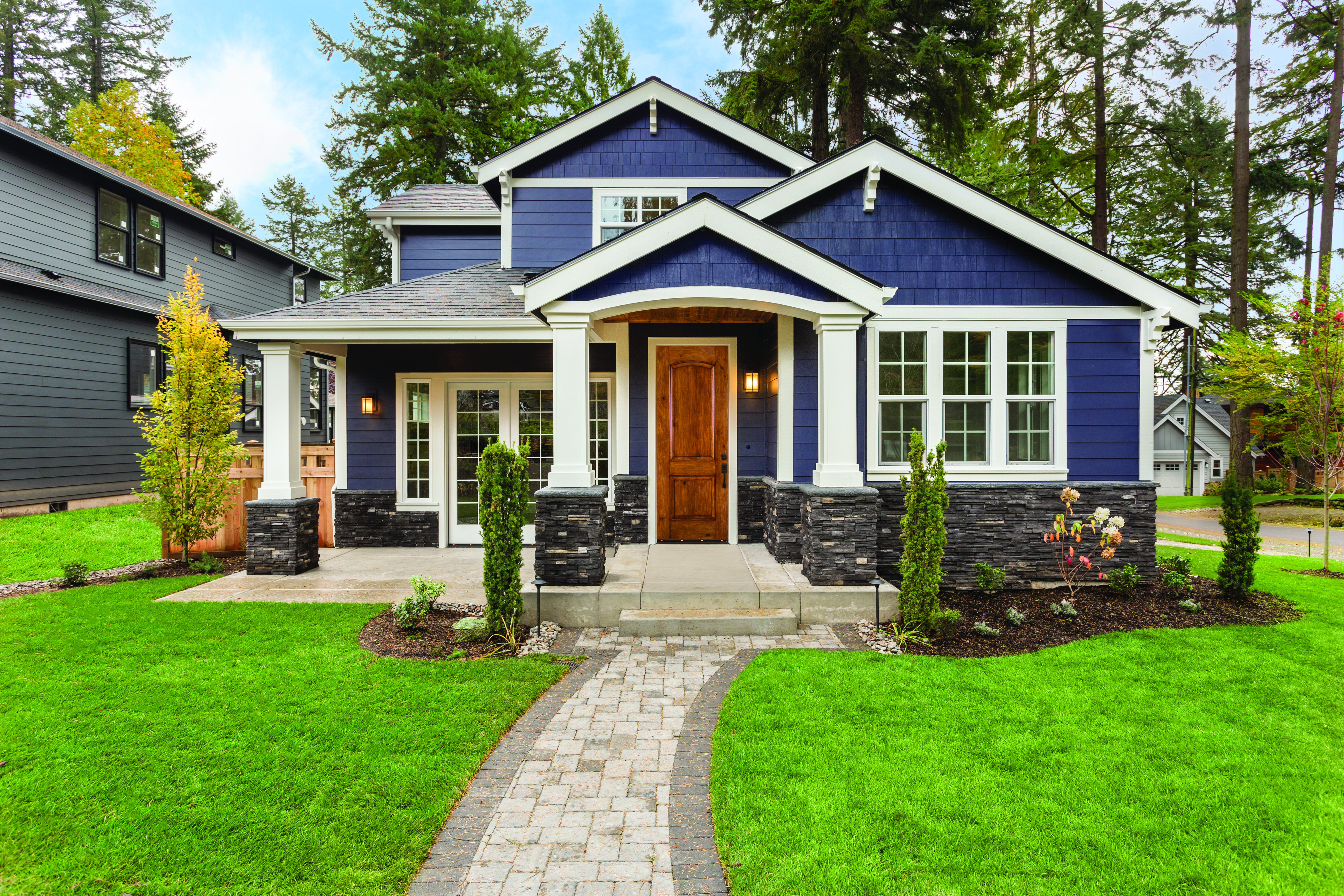 Premium Textured Fiberglass door with a 2-Panel Arch door style, and Addison Handleset hardware in Matte Black.