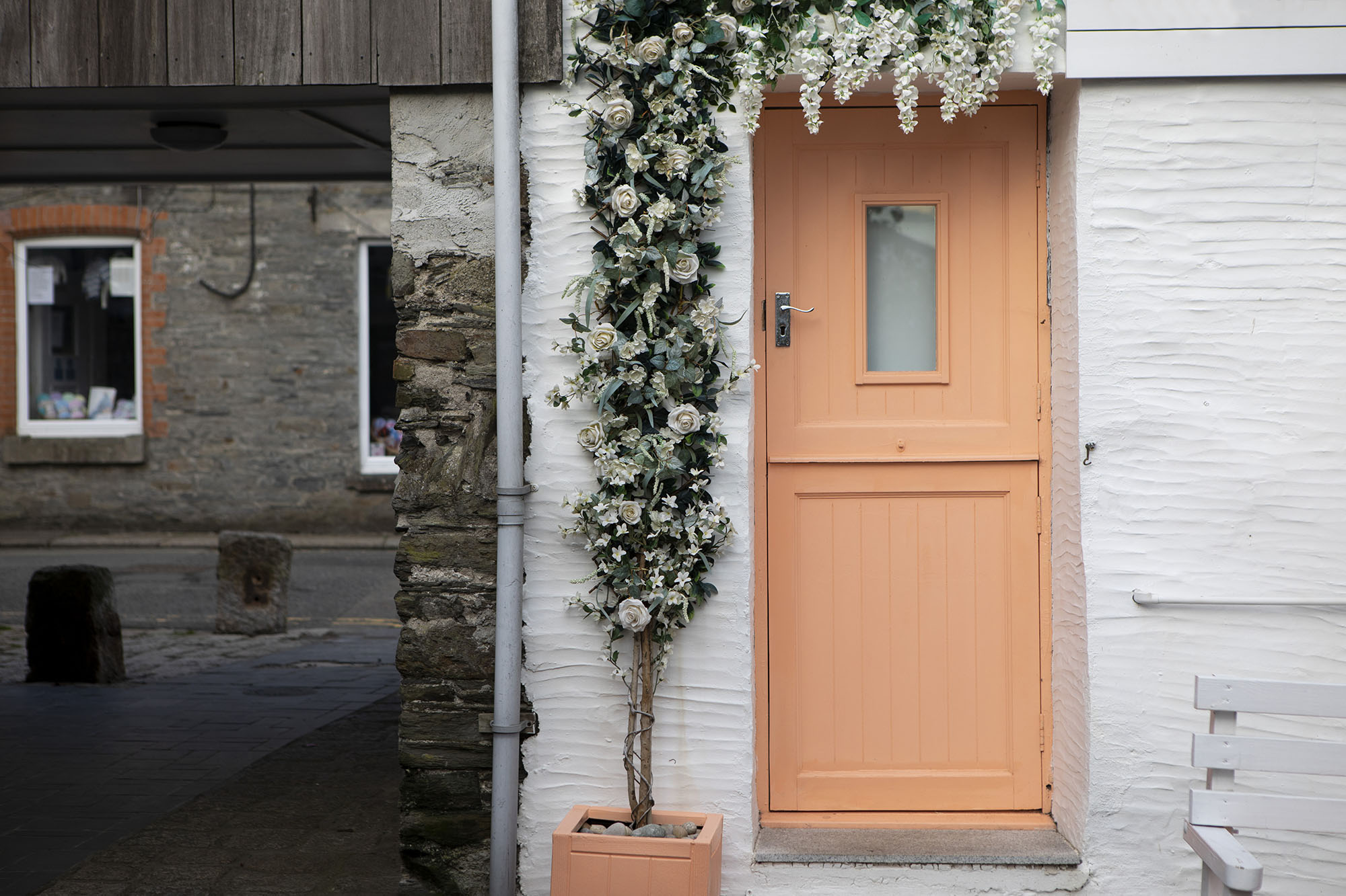 Pantone 2024 Color of the Year Peach Fuzz on a home’s front door