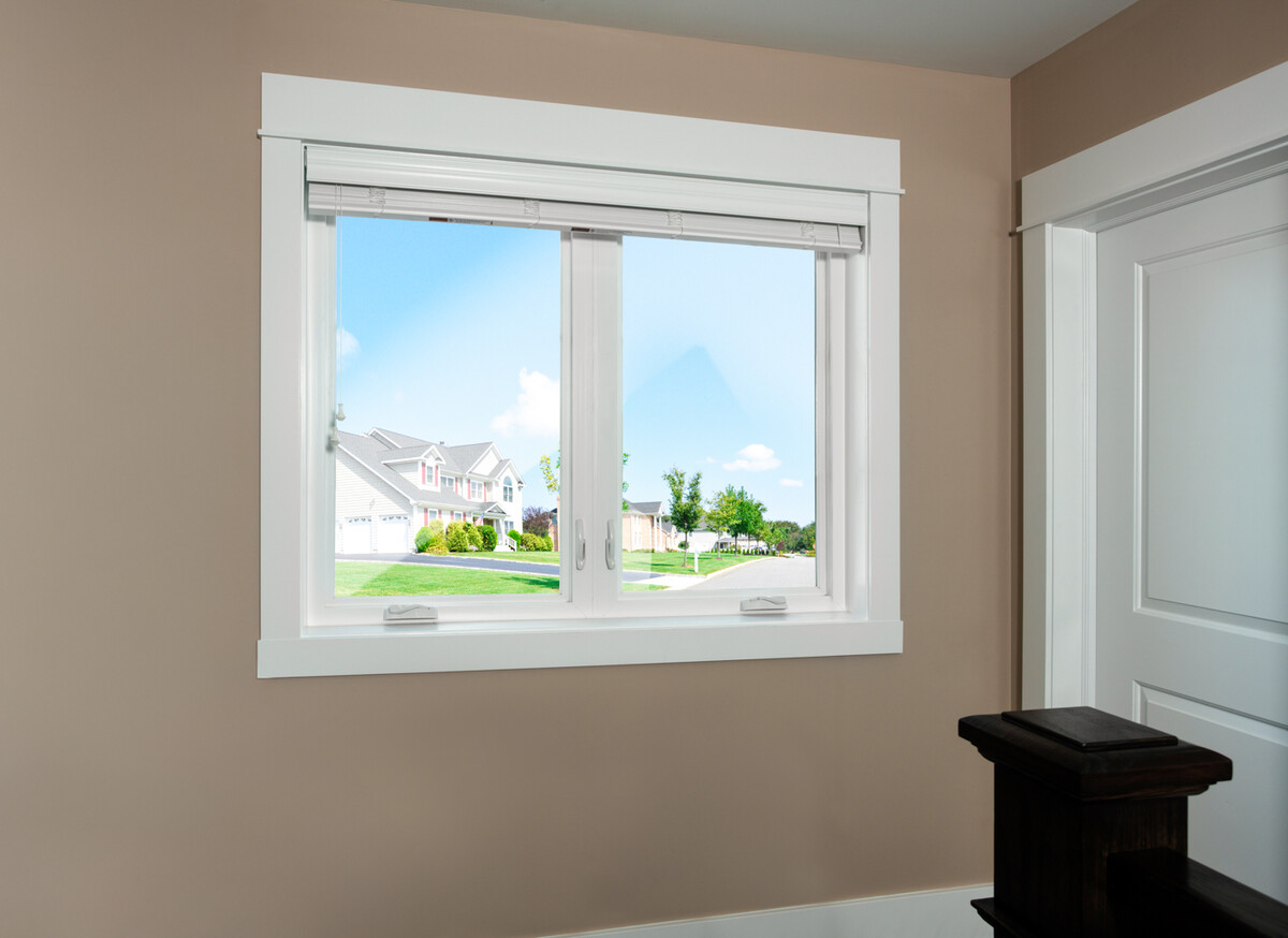 casement windows in a bright living space offer wide, open views of a suburban neighborhood with crisp sightlines and easy ventilation