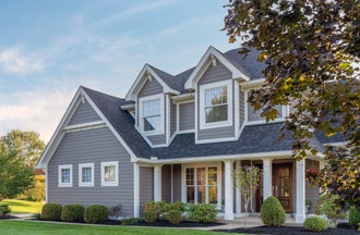 Large 2-story ranch home with hardie plank, shingle, panel, soffit and trim in Aged Pewter and Artic White