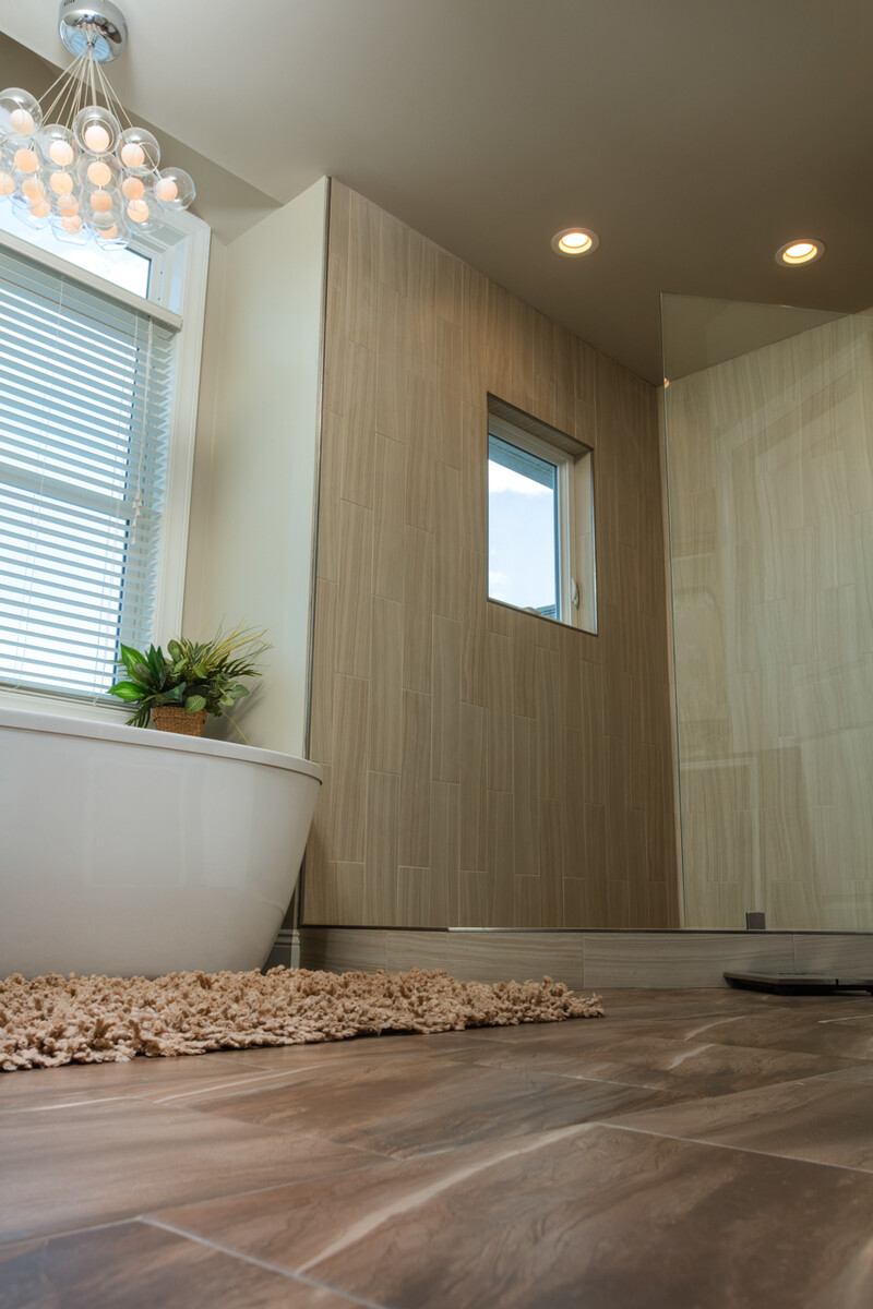 casement windows in a bright living space offer wide, open views of a suburban neighborhood with crisp sightlines and easy ventilation