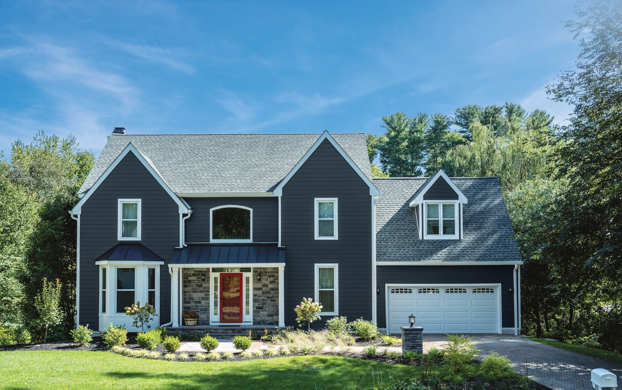 Two-story home with ASCEND composite cladding in Riviera Dusk and glacier white trim