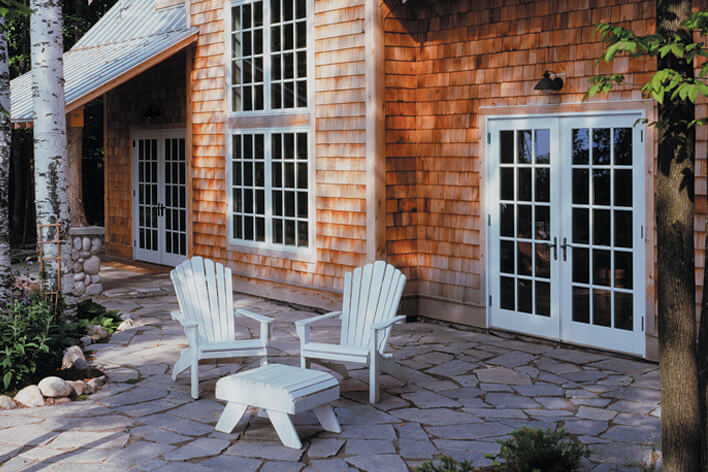 A back patio utilizing hardscaping as a low-maintenance landscaping idea