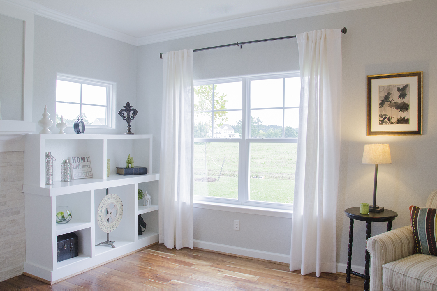 White new construction windows in the corner of a living room 