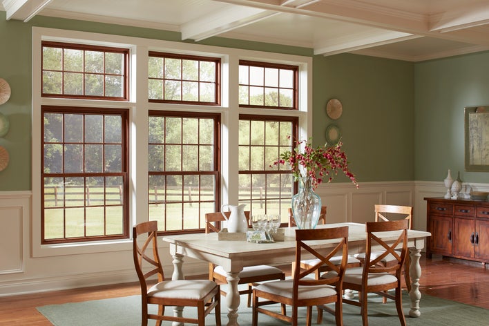 An elegant dining room with custom double-hung windows.