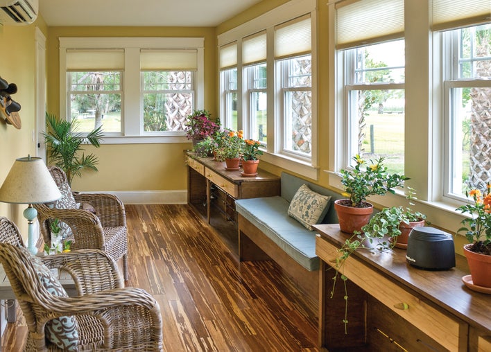 A sunroom full of double-hung windows, some of which won’t stay up and will need to be fixed.