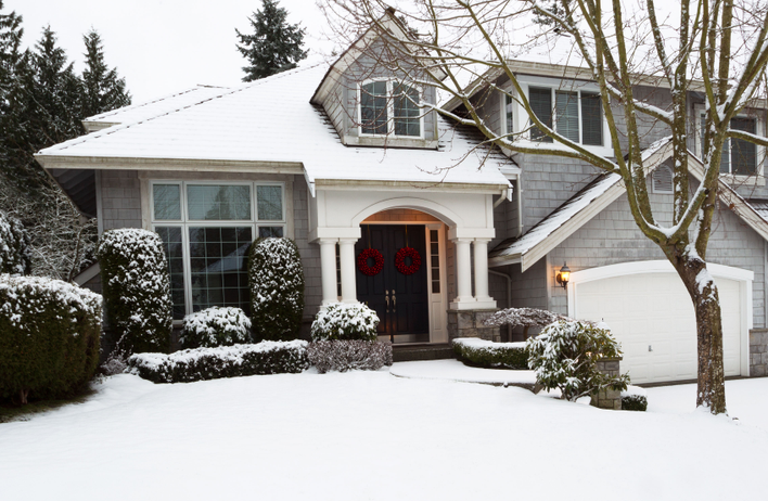 The snow-clad exterior of a winterized home.